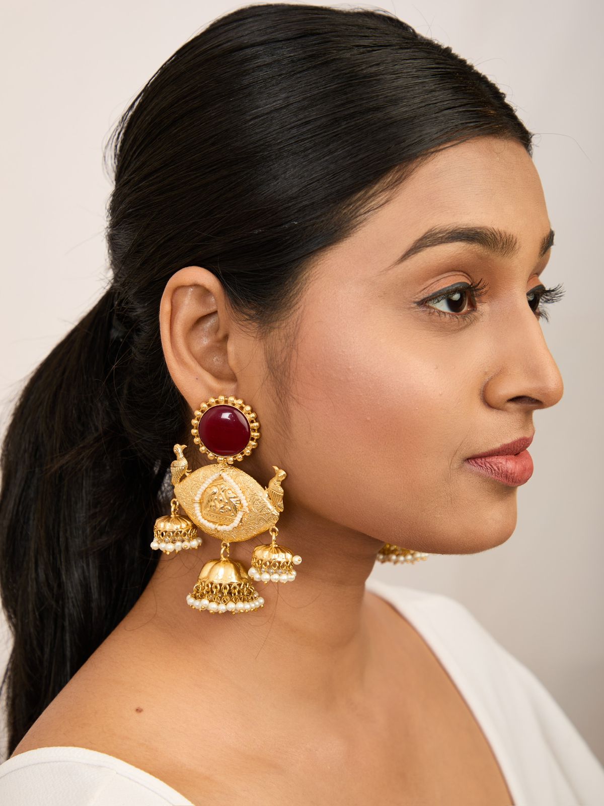 Exquisite golden and maroon green earrings